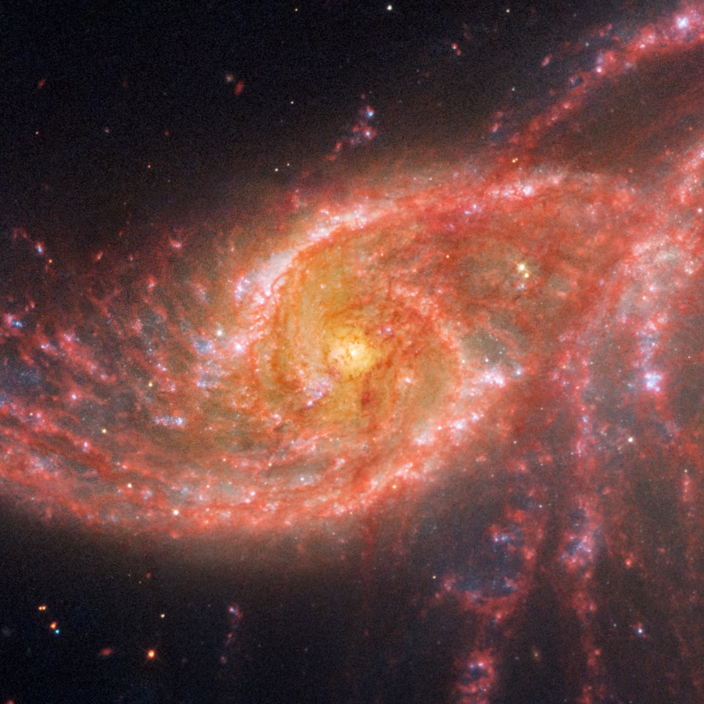 Par de galáxias NGC 2207 e IC 2163 registrado pelo telescópio espacial James Webb
